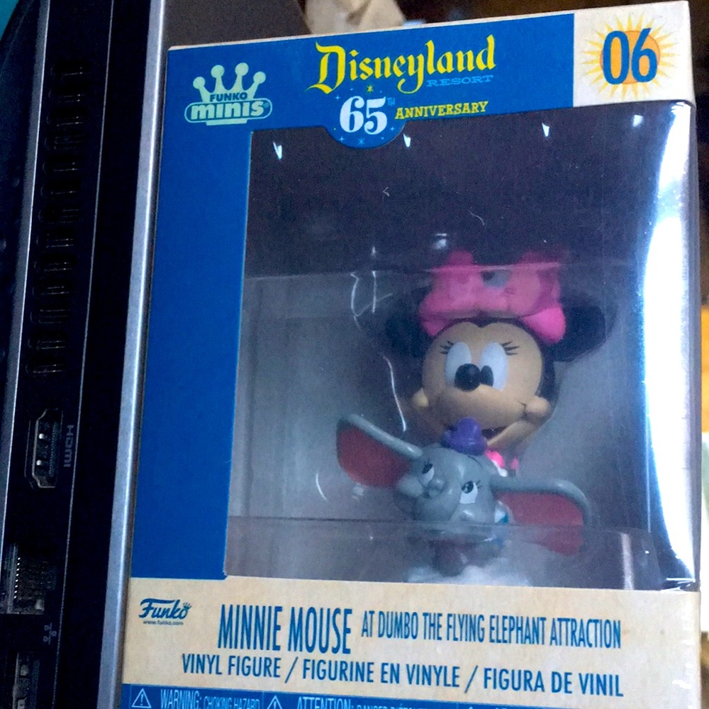 Minnie Mouse on Dumbo the Flying Elephant figure Disneyland 65th anniversary